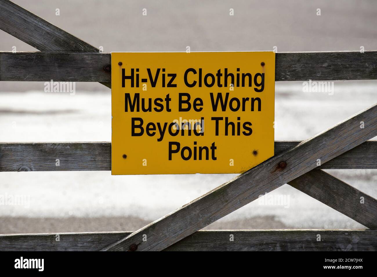 England, UK. 2020. High Visability clothing to be worn beyond this point sign on a farm gate. Stock Photo