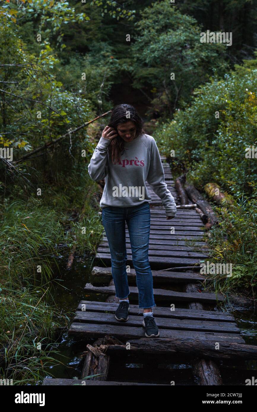 A young woman on a hike in the rain in the Adirondacks Stock Photo - Alamy
