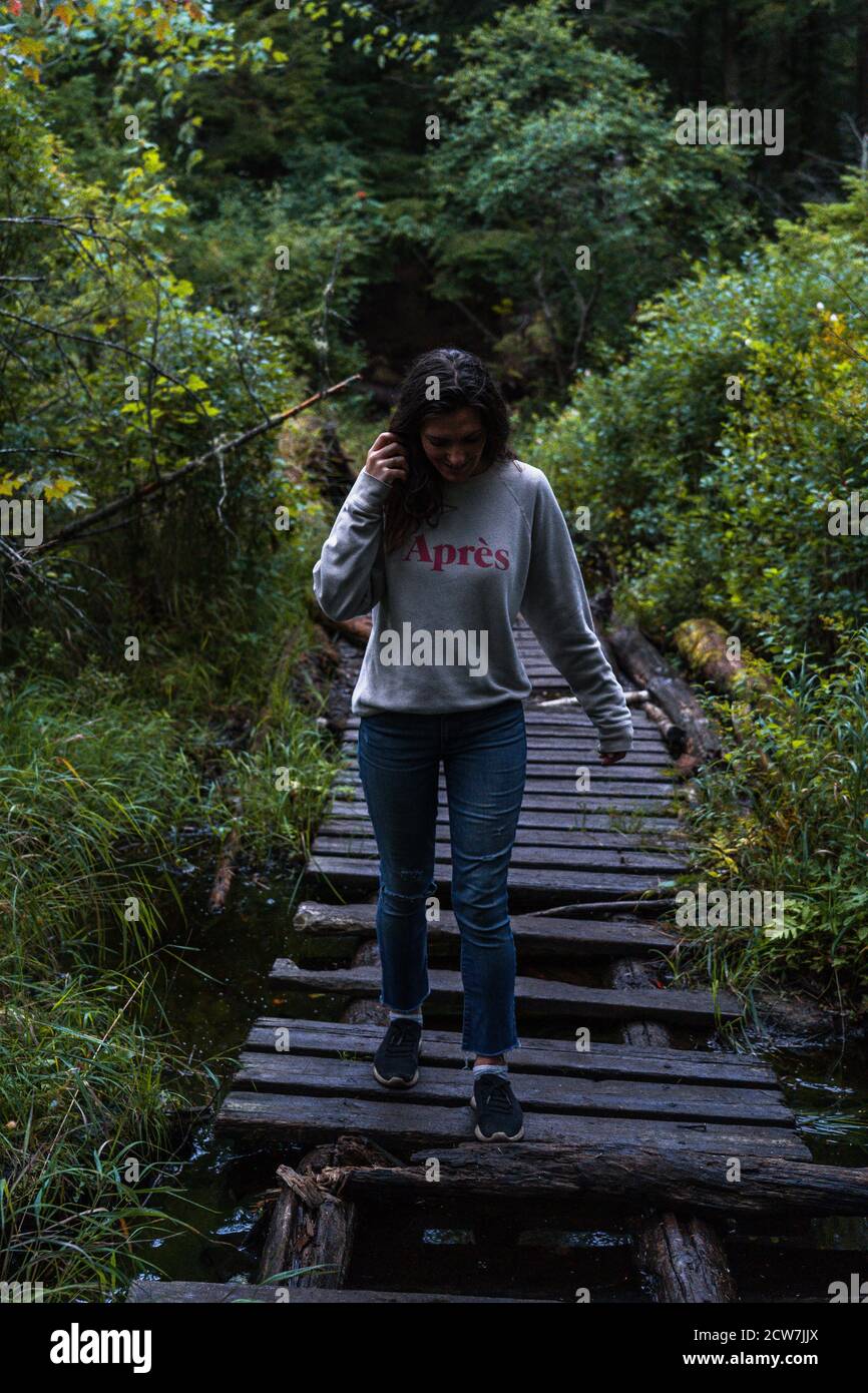 A young woman on a hike in the rain in the Adirondacks Stock Photo - Alamy