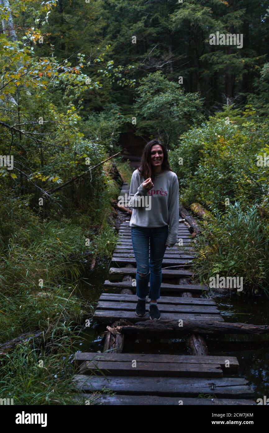 A young woman on a hike in the rain in the Adirondacks Stock Photo - Alamy
