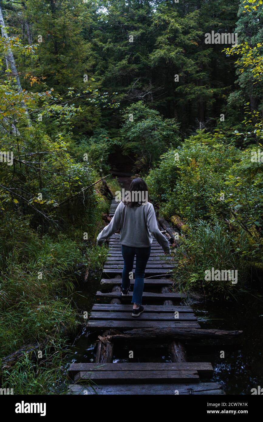 A young woman on a hike in the rain in the Adirondacks Stock Photo - Alamy