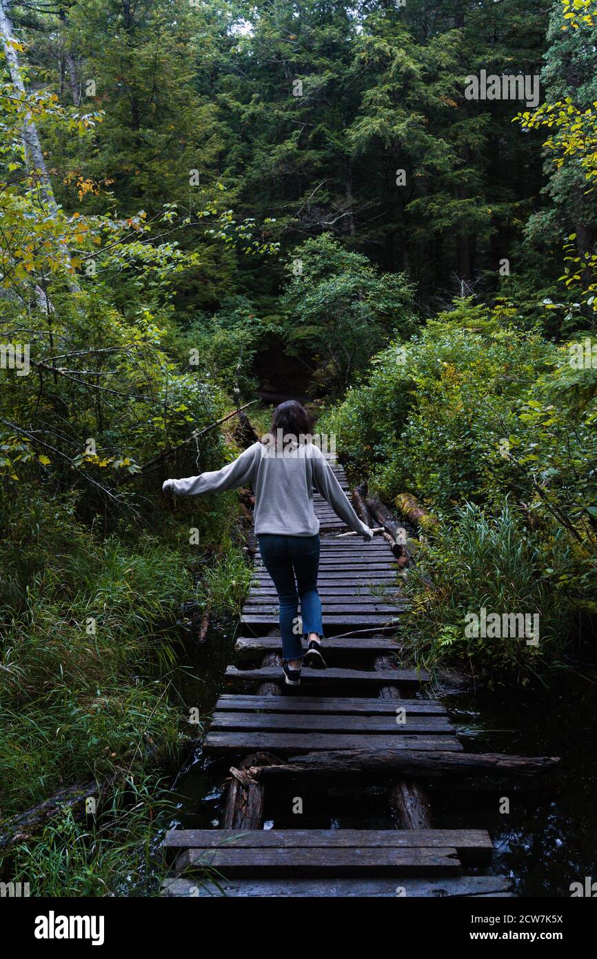 A young woman on a hike in the rain in the Adirondacks Stock Photo - Alamy