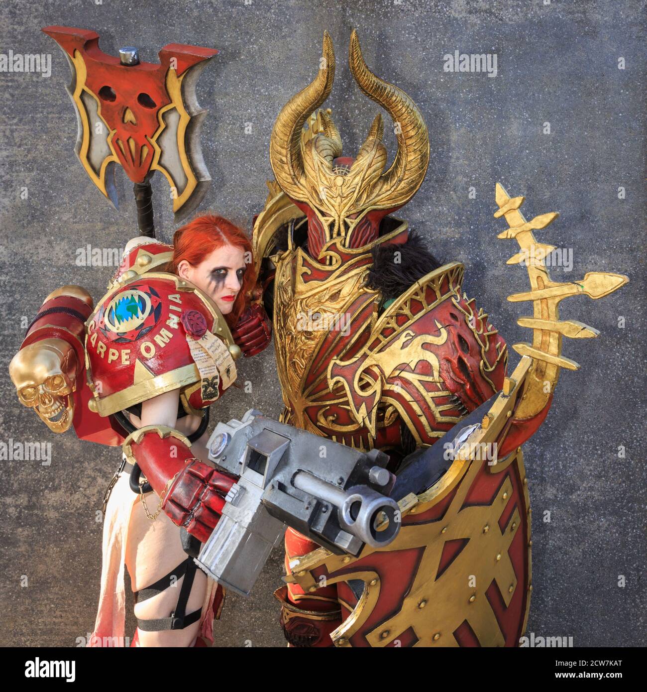 Two concept art characters from Warhammer 40K pose in their elaborate cosplayer outfits at MCM Comicon London, UK Stock Photo