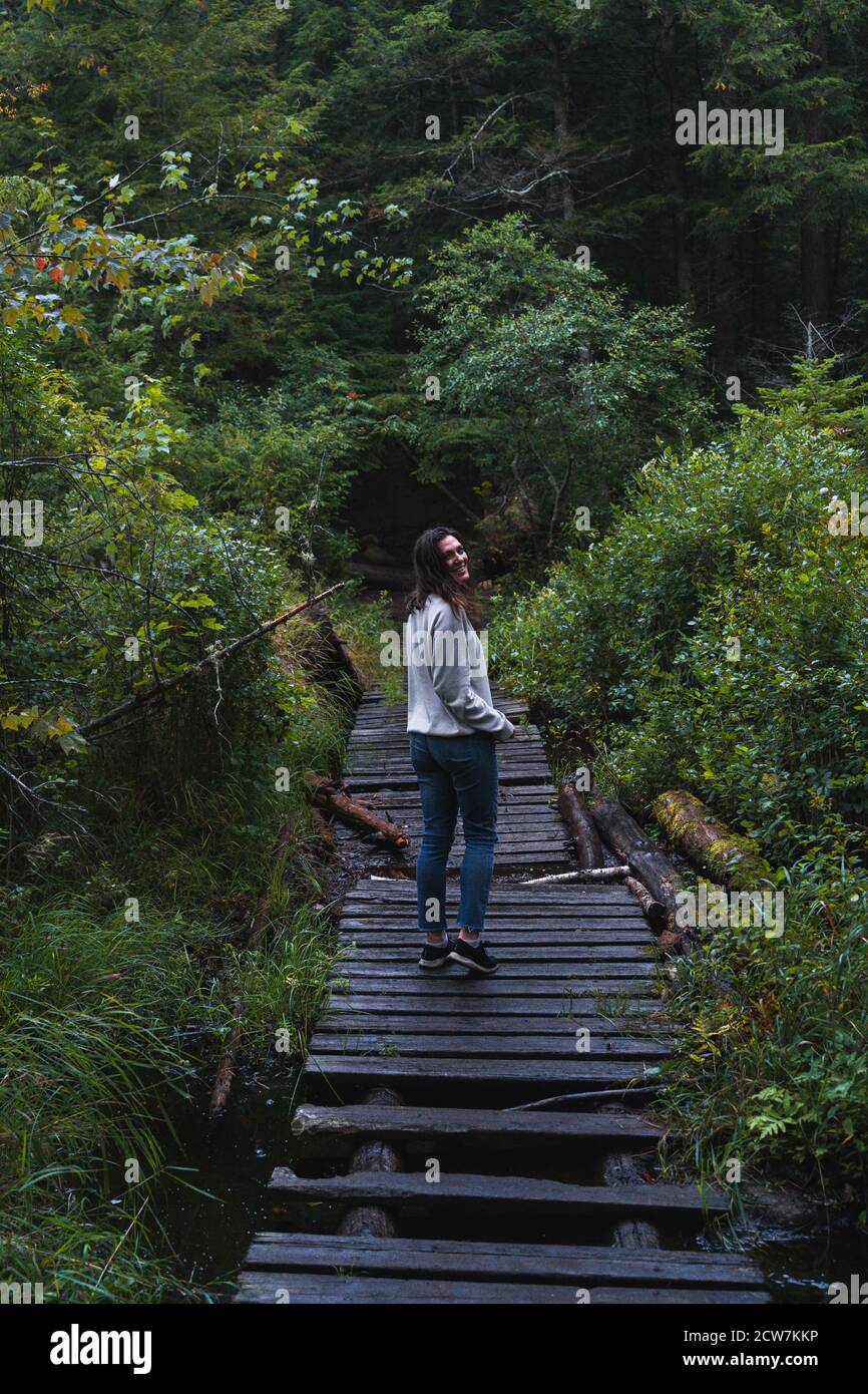 A young woman on a hike in the rain in the Adirondacks Stock Photo - Alamy