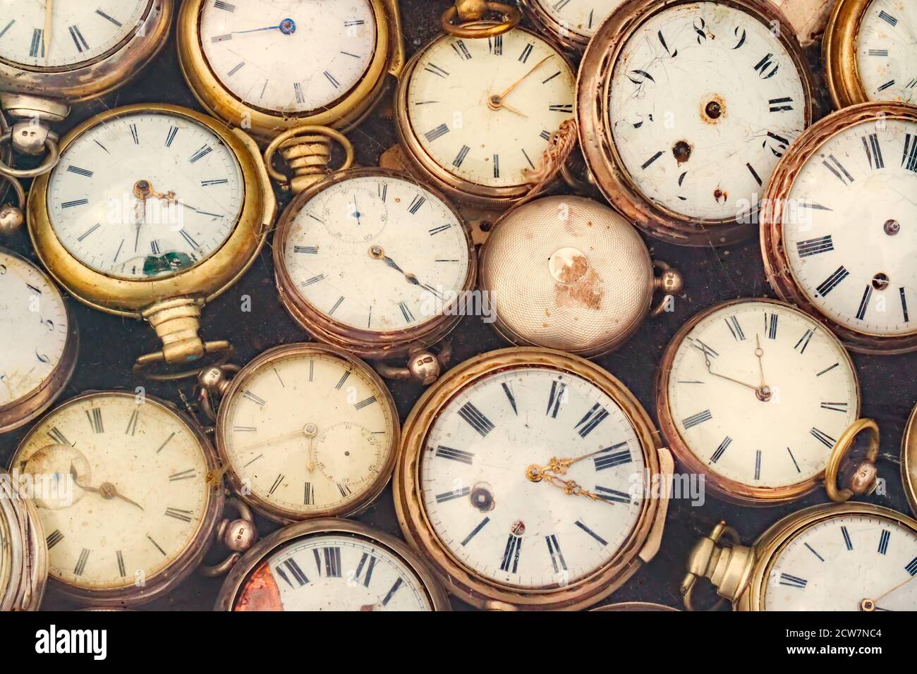 Retro styled image of old scratched and run down pocket watches Stock Photo