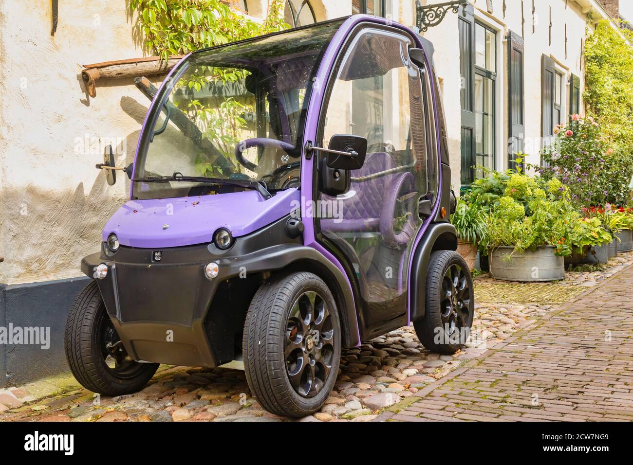 Elburg, The Netherlands - August 27, 2020: Small two person full electric mini car Biro parked in the Dutch city of Elburg, The Netherlands Stock Photo