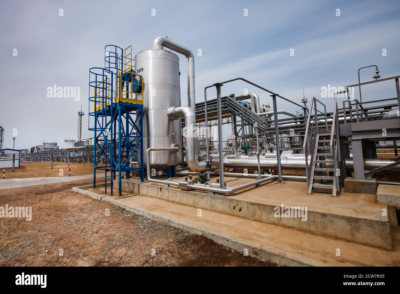 Refinery equipment, pipes, pipelines. Oil refinery and gas processing plant. Zhaik-Munai oil deposit, Kazakhstan. Stock Photo