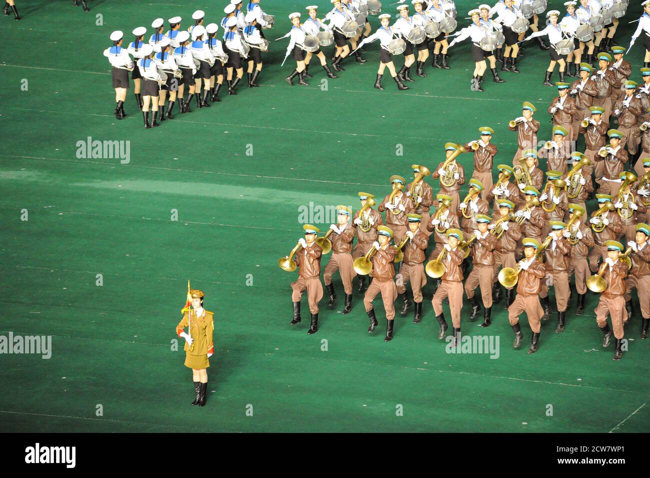 08.08.2012, Pyongyang, North Korea - Military band plays brass band music during the mass choreography and Artistic Performance at Arirang Festival. Stock Photo