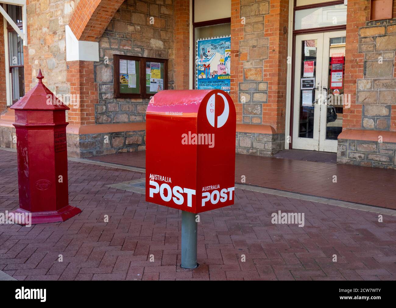 Australia Post modern and traditional red mailboxes in front of York Post Office on Avon Terrace York Western Australia. Stock Photo