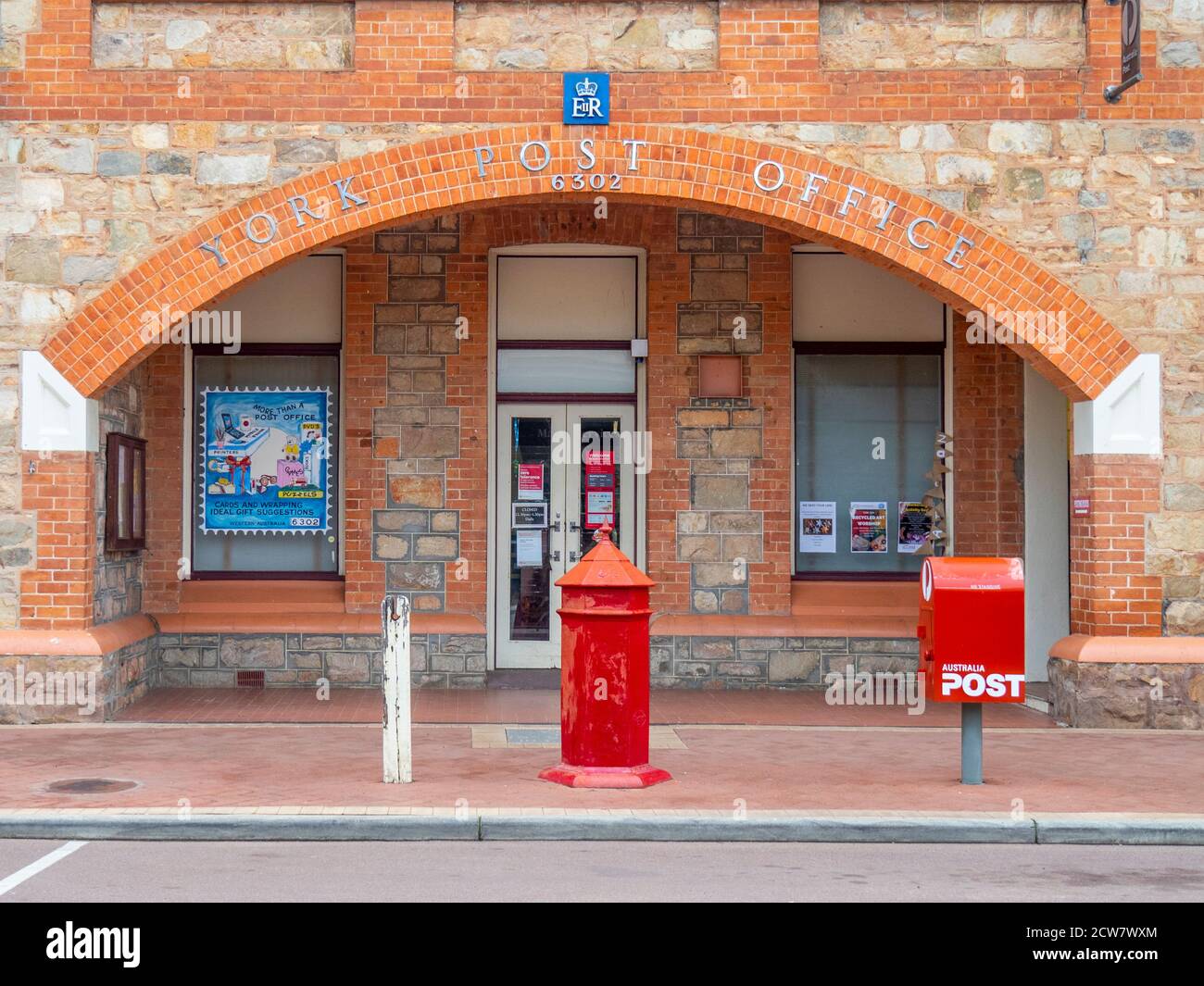 Australia Post modern and traditional red mailboxes in front of York Post Office on Avon Terrace York Western Australia. Stock Photo