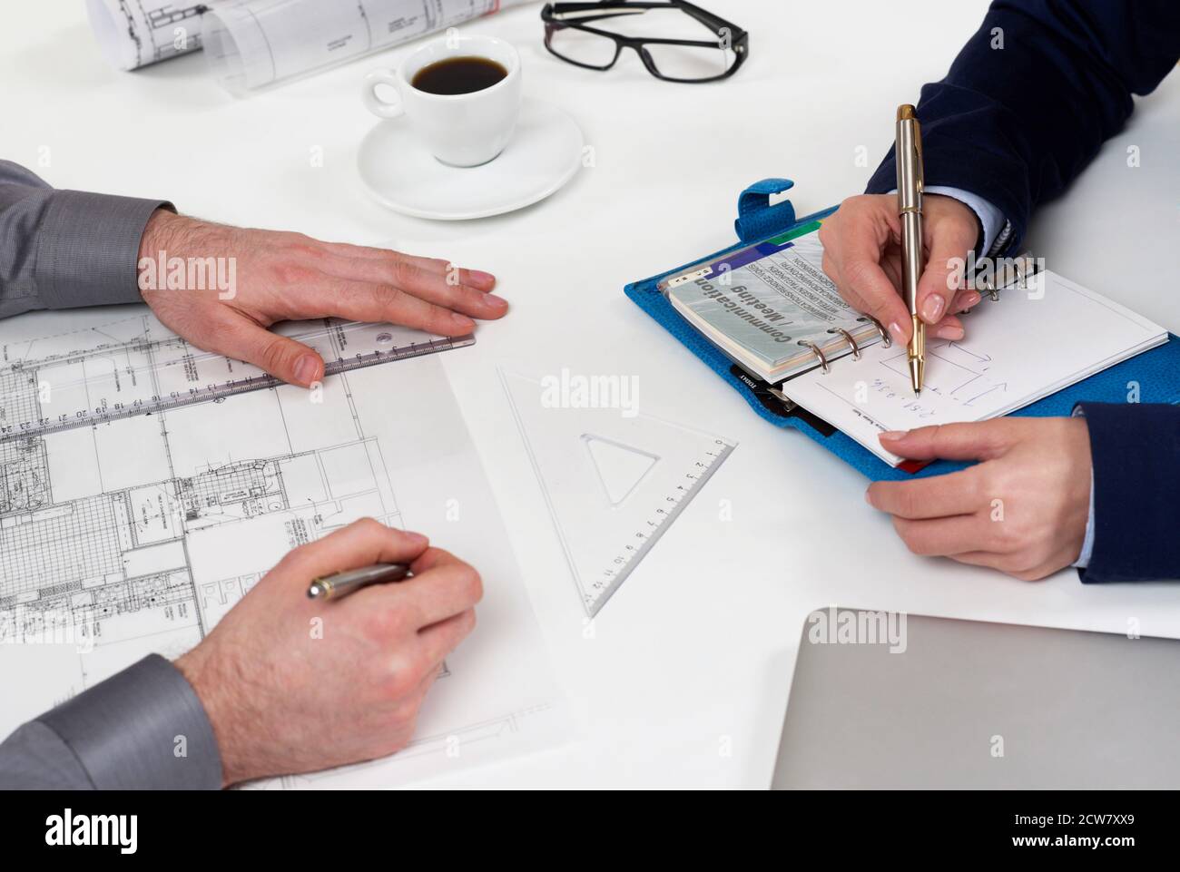 People working on blueprints Stock Photo