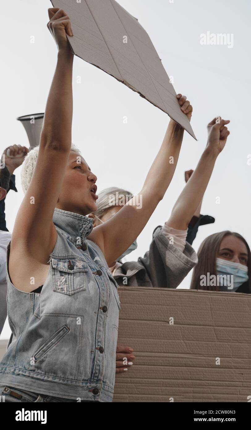 Freedom. Group of activists giving slogans in a rally. Caucasian men ...