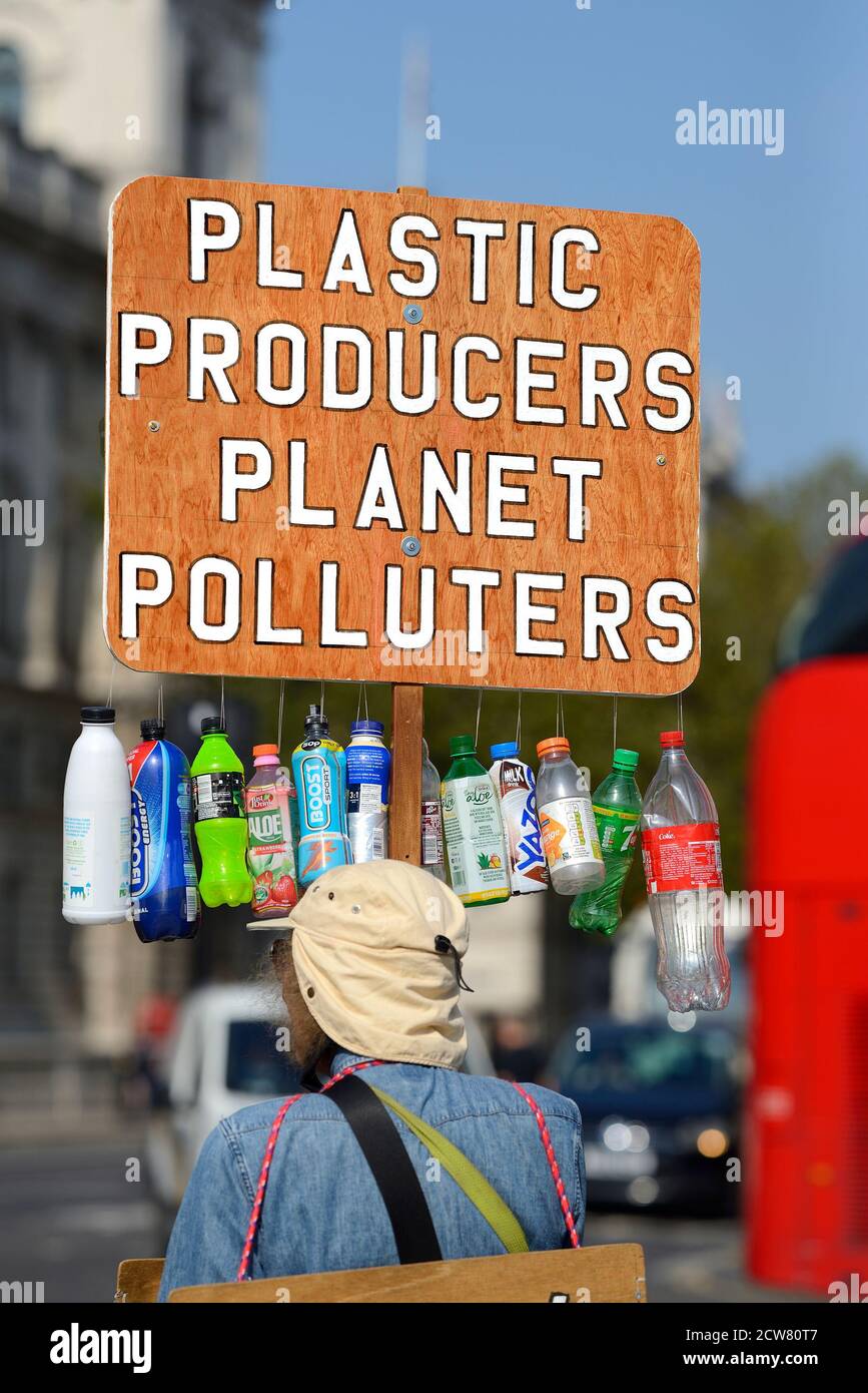 London, England, UK. Regular environmental protester in Parliament Square with 'Plastic Producers Planet Polluters' banner Stock Photo