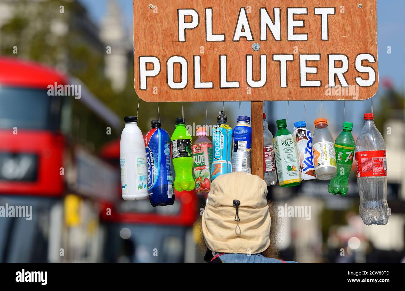 London, England, UK. Regular environmental protester in Parliament Square with 'Plastic Producers Planet Polluters' banner Stock Photo