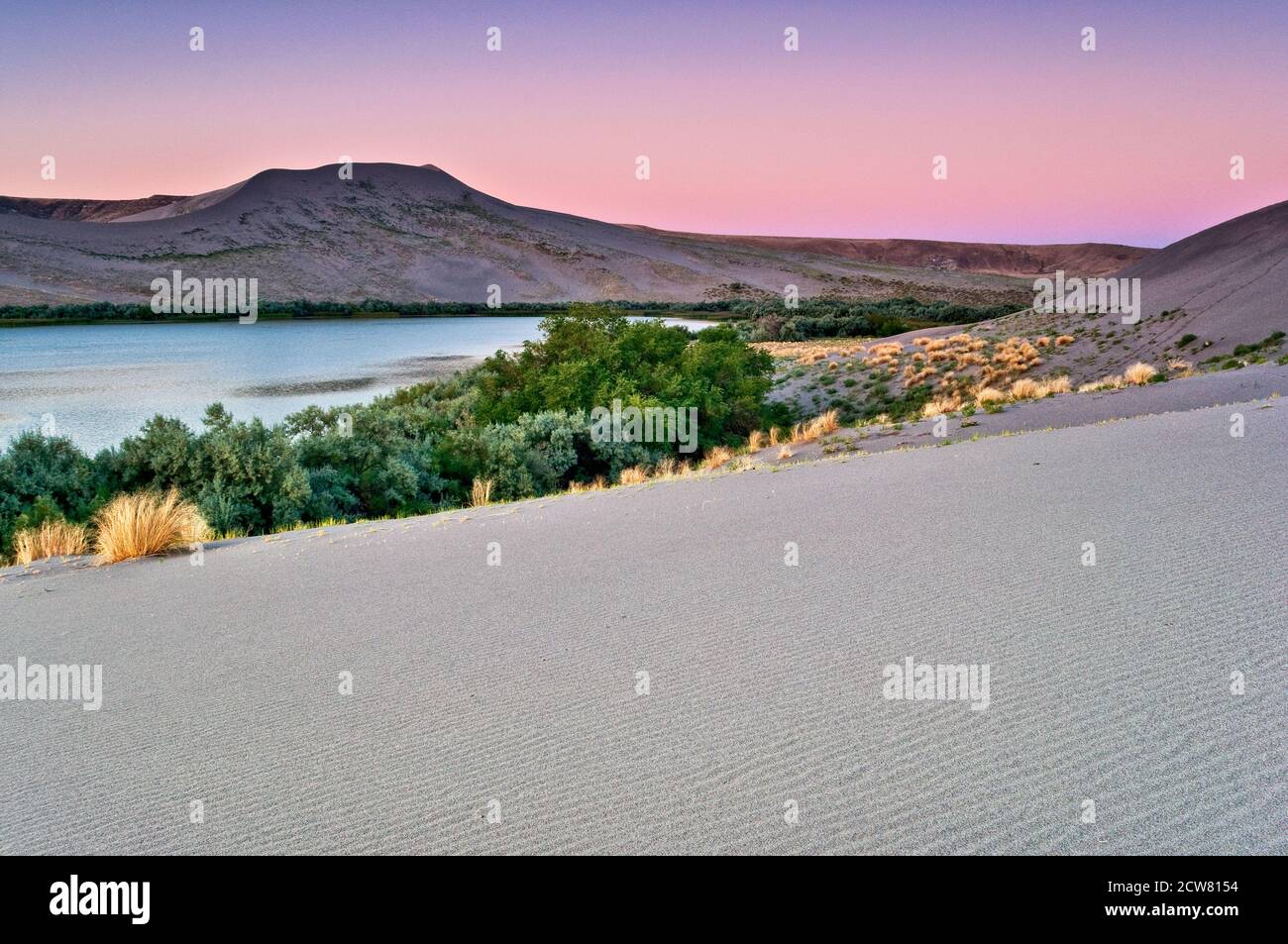 Big Dune over Sand Dunes Lake at sunrise, Bruneau Dunes State Park