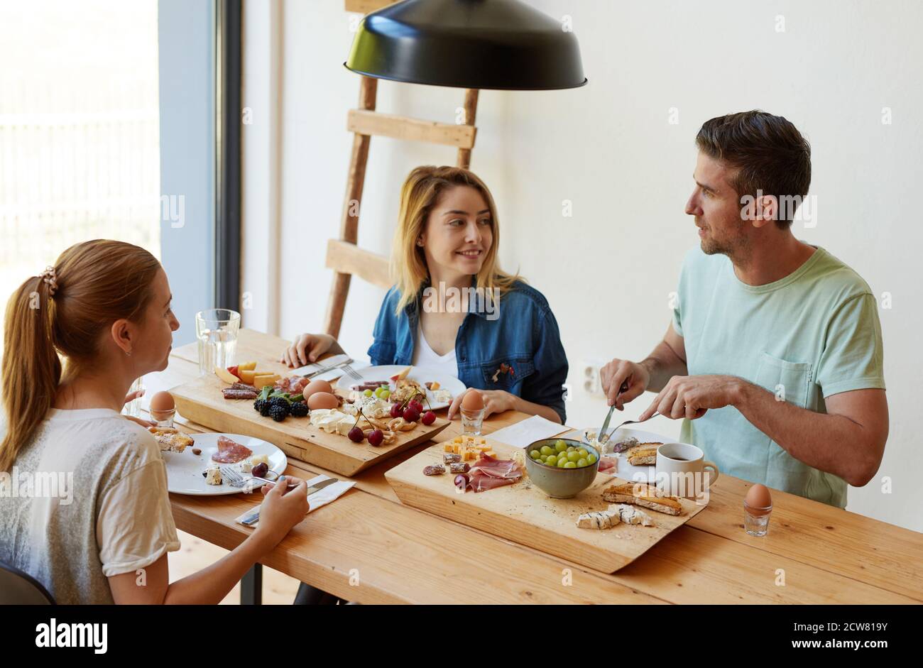 Cheerful friends having social hi-res stock photography and images - Alamy