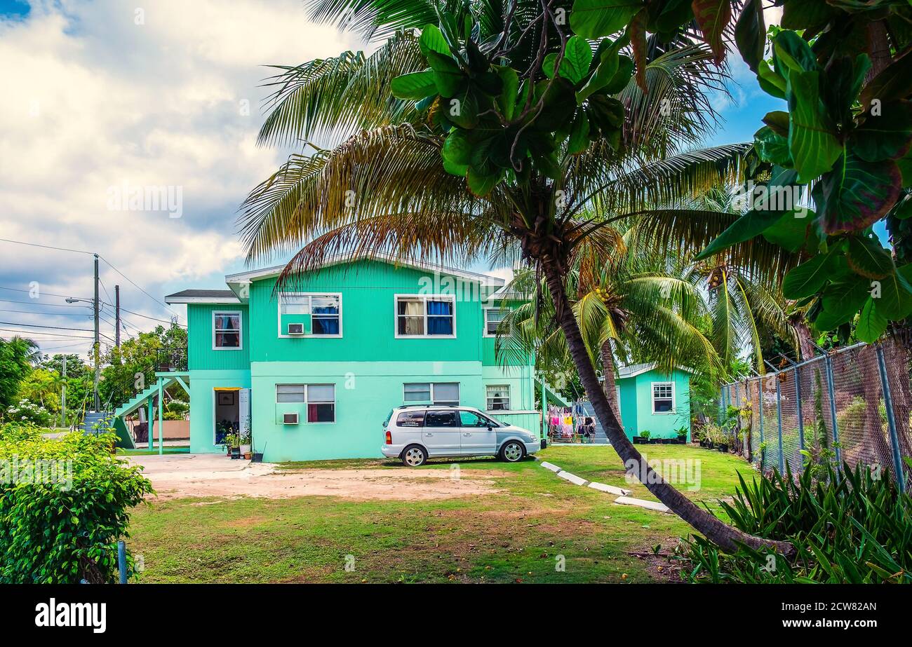 Grand Cayman, Cayman Islands, July 2020, view of a green two-story house in George Town Stock Photo