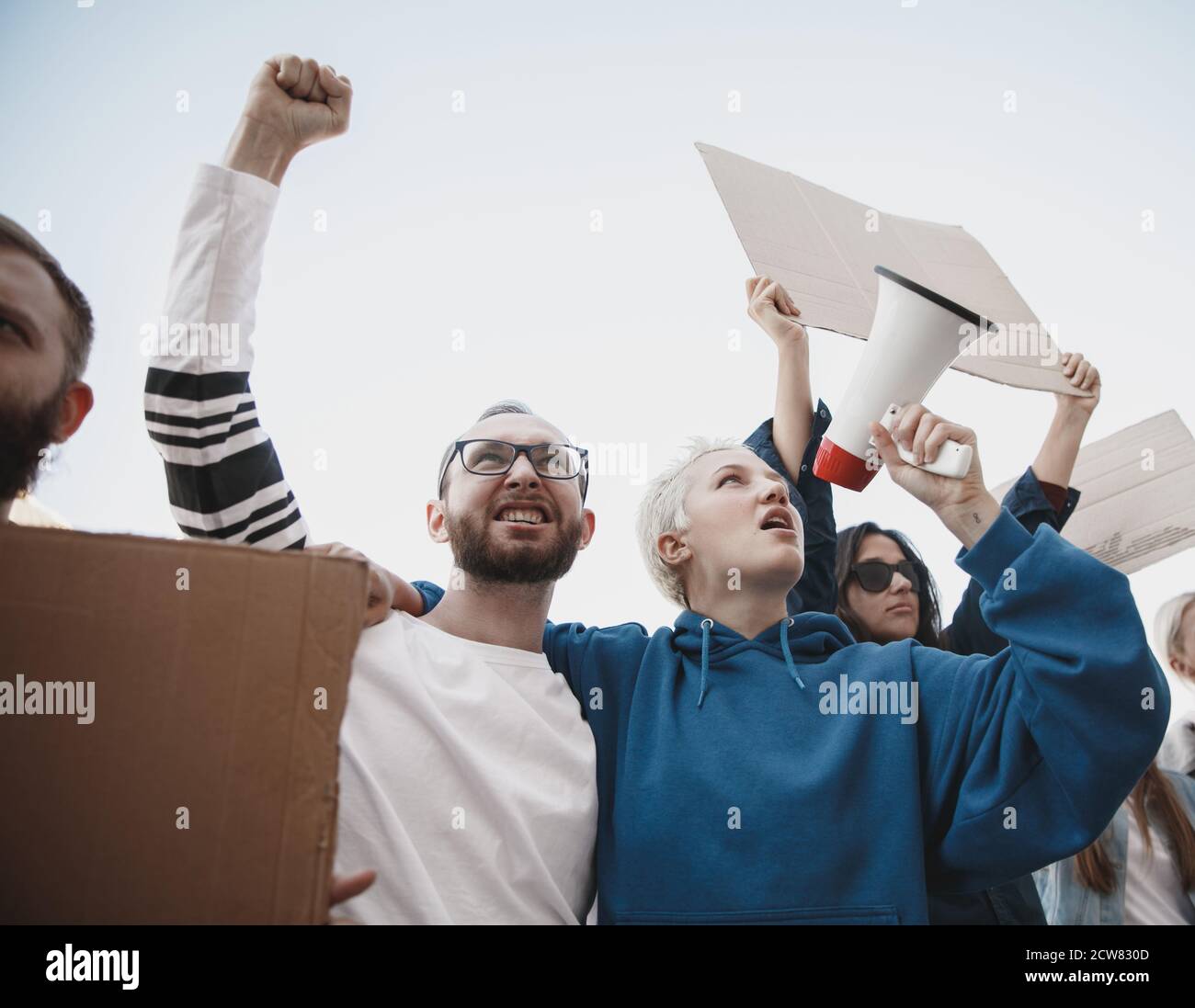Human hand holding protest banner hi-res stock photography and images ...