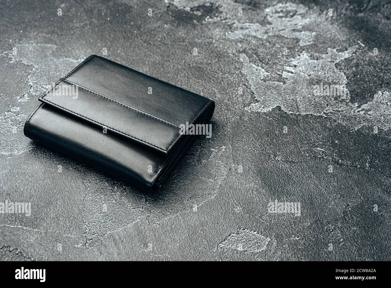 New black leather wallet on dark background Stock Photo - Alamy