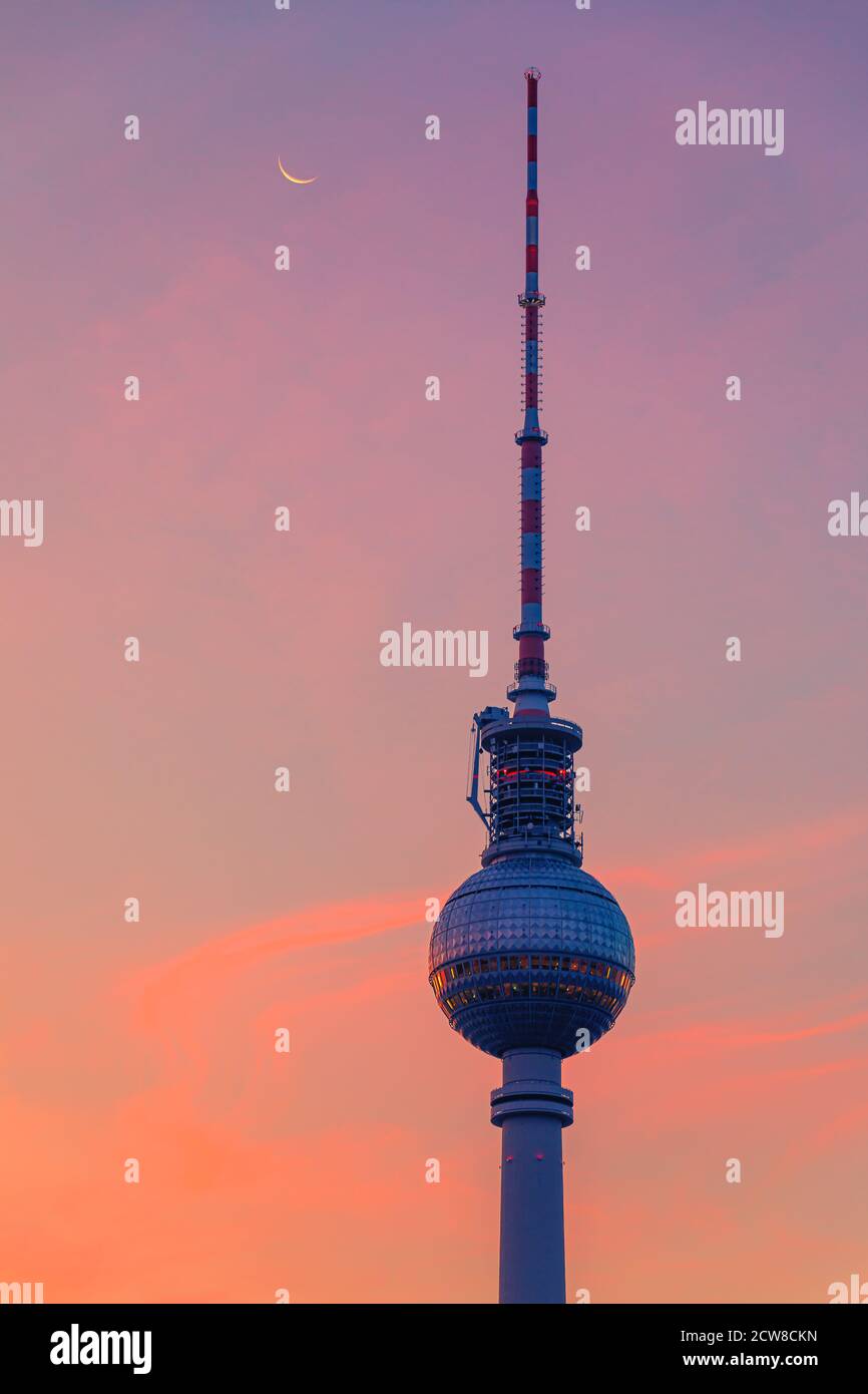 Sunrise at the Berlin TV Tower. The Berliner Fernsehturm or Fernsehturm Berlin (English: Berlin Television Tower) is a television tower in central Ber Stock Photo