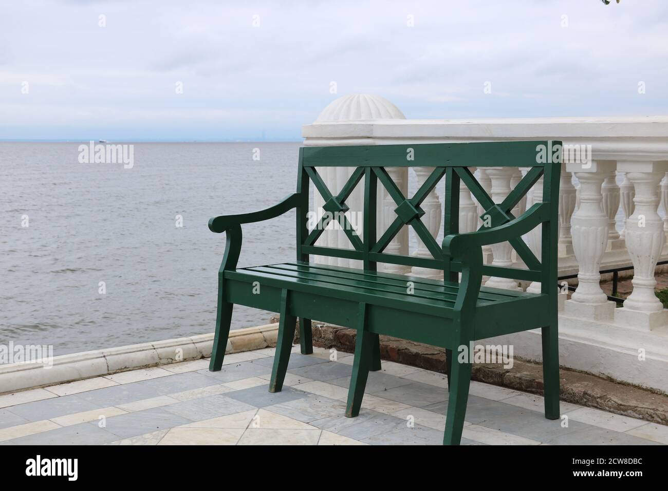 green wooden bench on gulf of Finland Russia Stock Photo