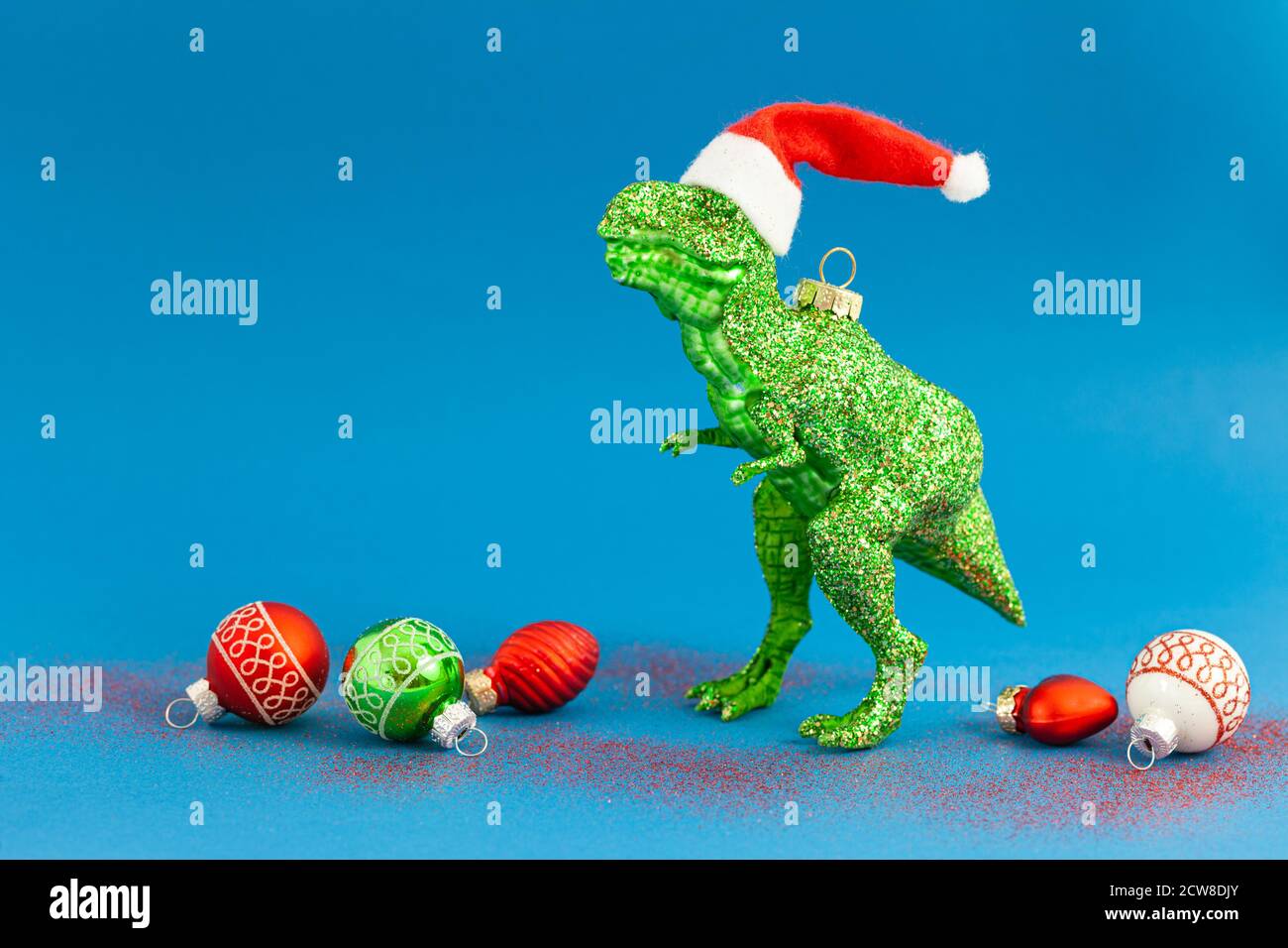 Kitschy T-Rex christmas ornaments for the holidays, Santa hat Stock Photo