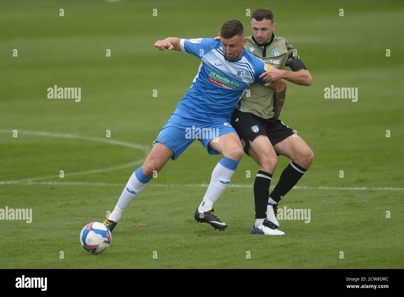 Scott Quigley of Barrow does battle with Tommy Smith of Colchester United - Barrow v Colchester United, Sky Bet League Two, The Progression Solicitors Stadium, Barrow-in-Furness, UK - 26th September 2020  Editorial Use Only - DataCo restrictions apply Stock Photo