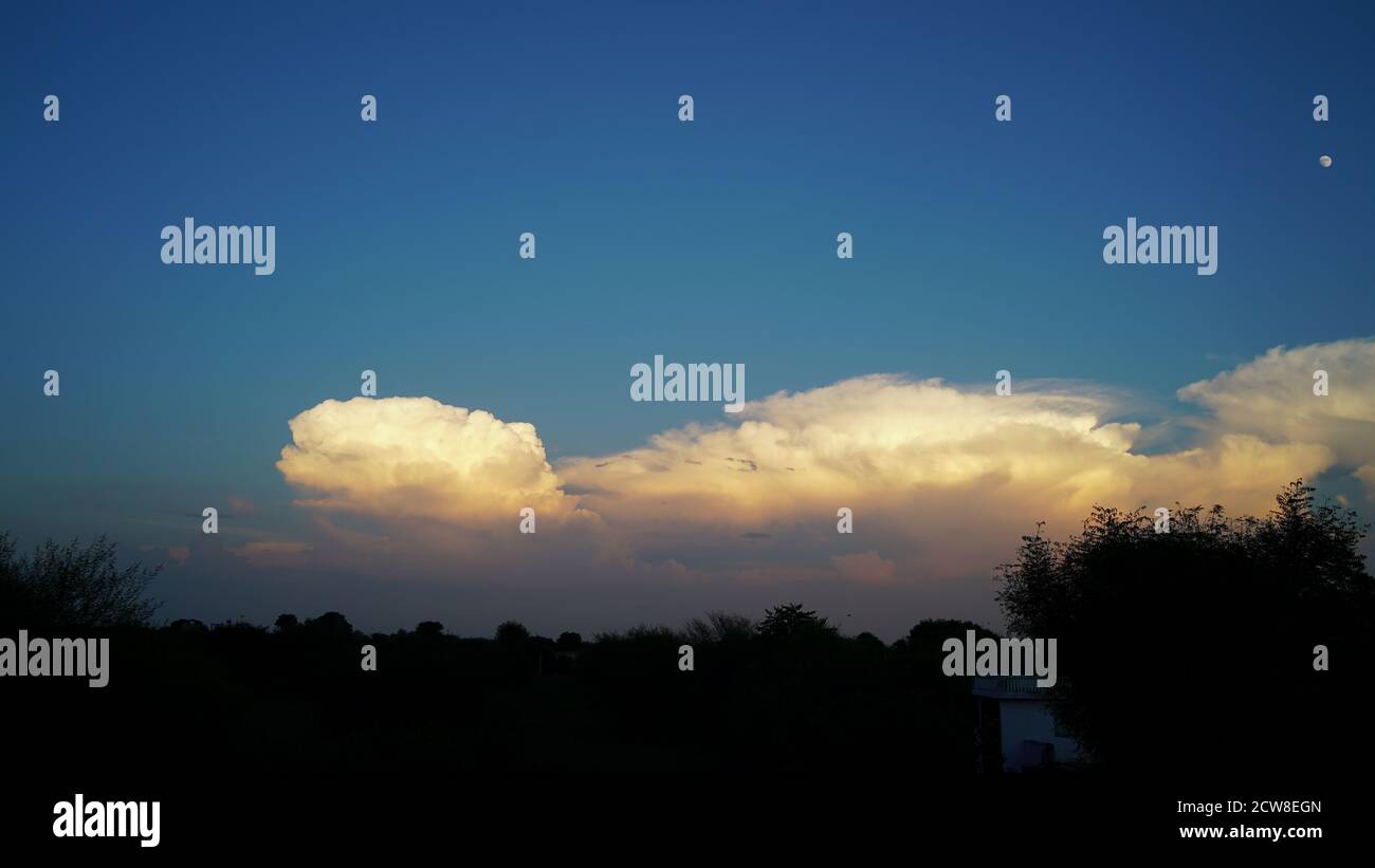Wonderful golden clouds. Natural light on the sky in the evening Stock Photo