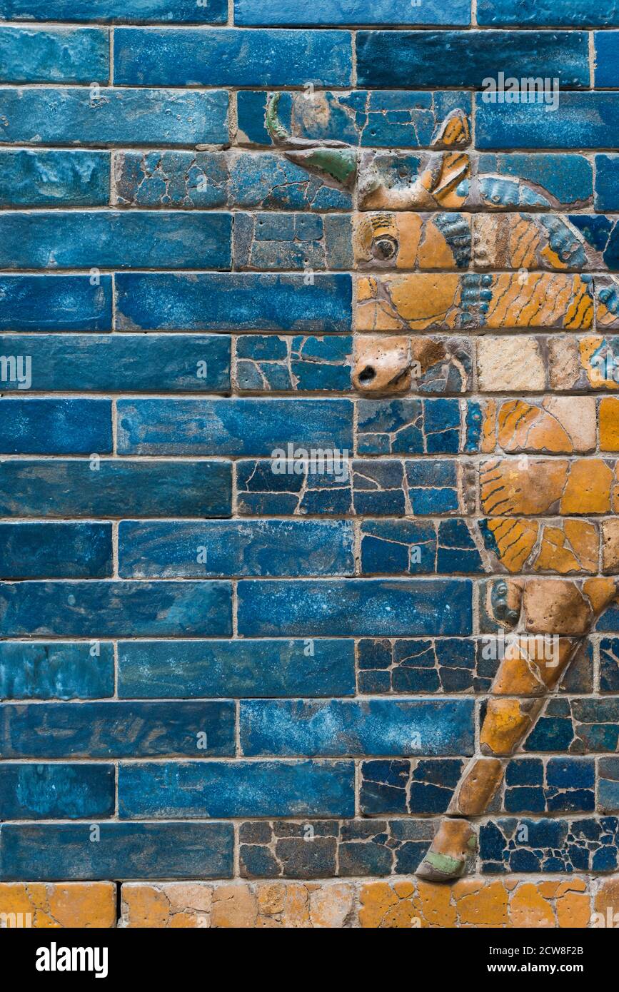 fragment of Aurochs symbol of Hadad deity on blue ceramic wall from ancient Babylon Stock Photo
