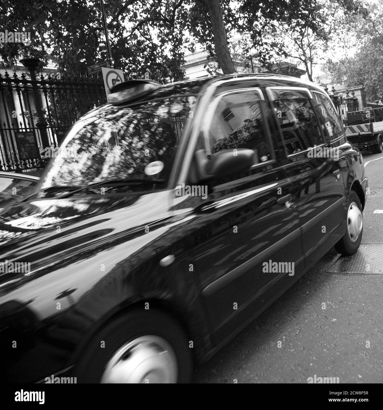 Lonodn, UK - August 13, 2010 : Taxi in the street of London on May 8, 2010 in London, UK. Cabs, Taxis, are the most iconic symbol of London as well as Stock Photo