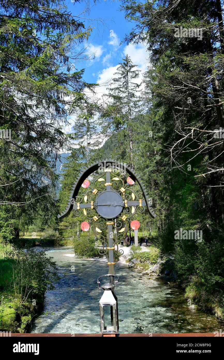 Austria, wayside shrine in Austria called Marterl on bridge over the Steyr river from the small lake Schiederweiher in the Kalkalpen National Park whi Stock Photo