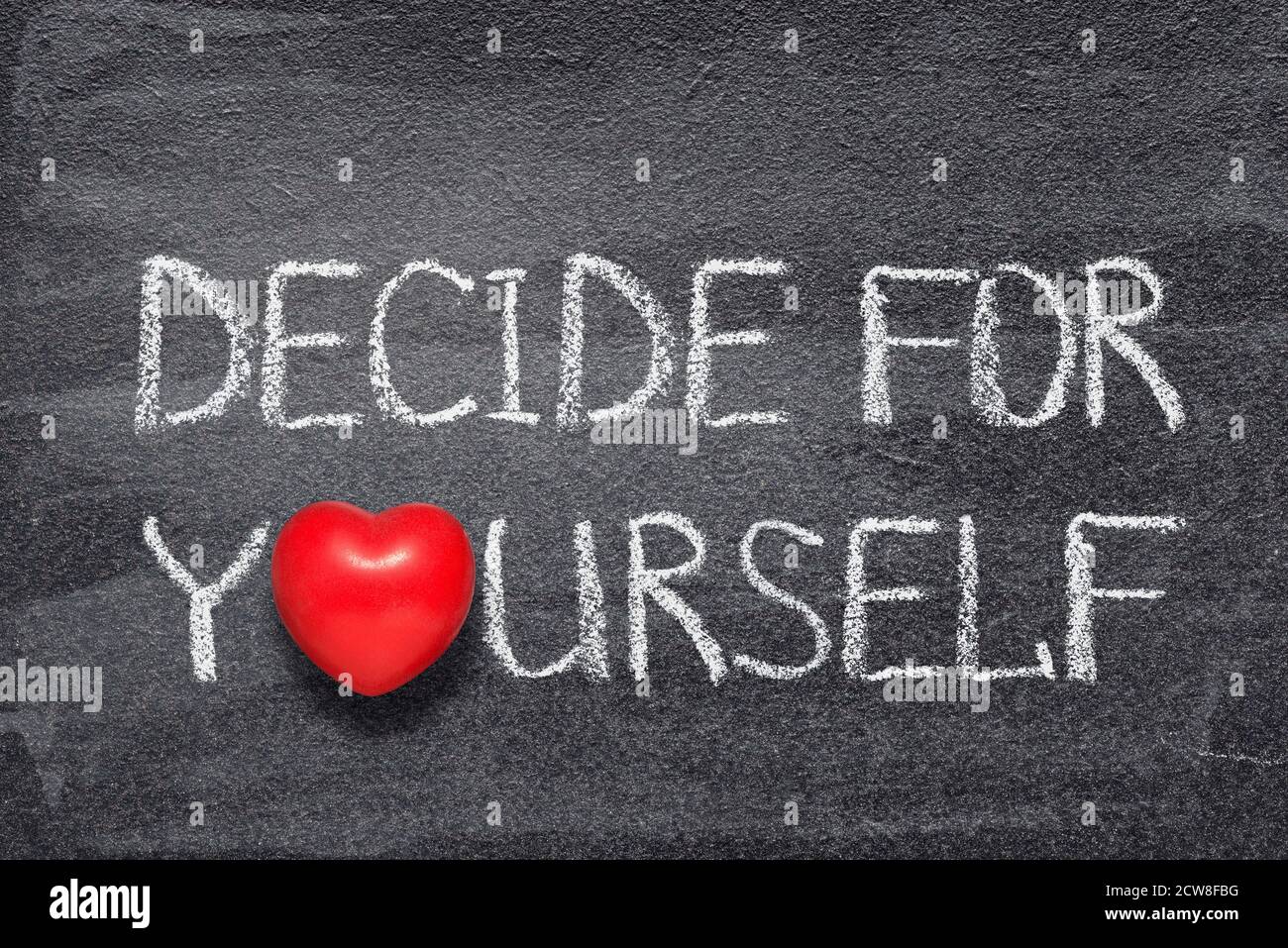 decide for yourself phrase written on chalkboard with red heart symbol Stock Photo