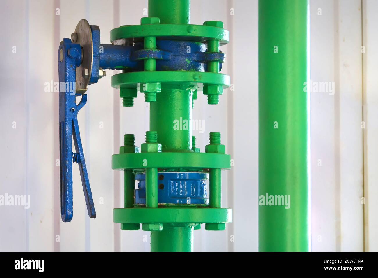 A valve on the hot water pipeline. Stock Photo