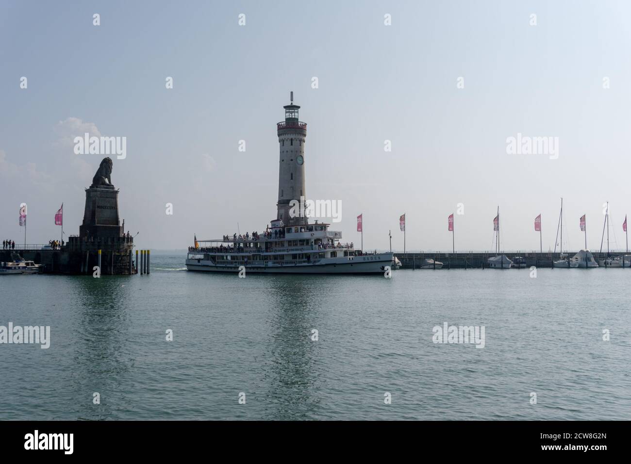 Lindau, Bavaria / Germany - 20 September 2020: passenger ship enters the protected harbor on Lindau Island on Lake Constance in Bavaria Stock Photo