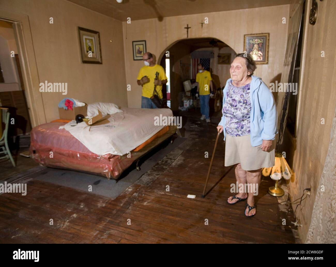 Galveston, TX September 27, 2008: More than two weeks after Hurrican Ike ravaged Galveston Island and east Texas, some Galveston residents are still living in squalor conditions. Patricia Aguilar, 75, of 1911 Avenue N on the east side, has been sleeping on a damp and moldy mattress until volunteers from a church group came by to clear her house of rotten food and furnishings. ©Bob Daemmrich Stock Photo