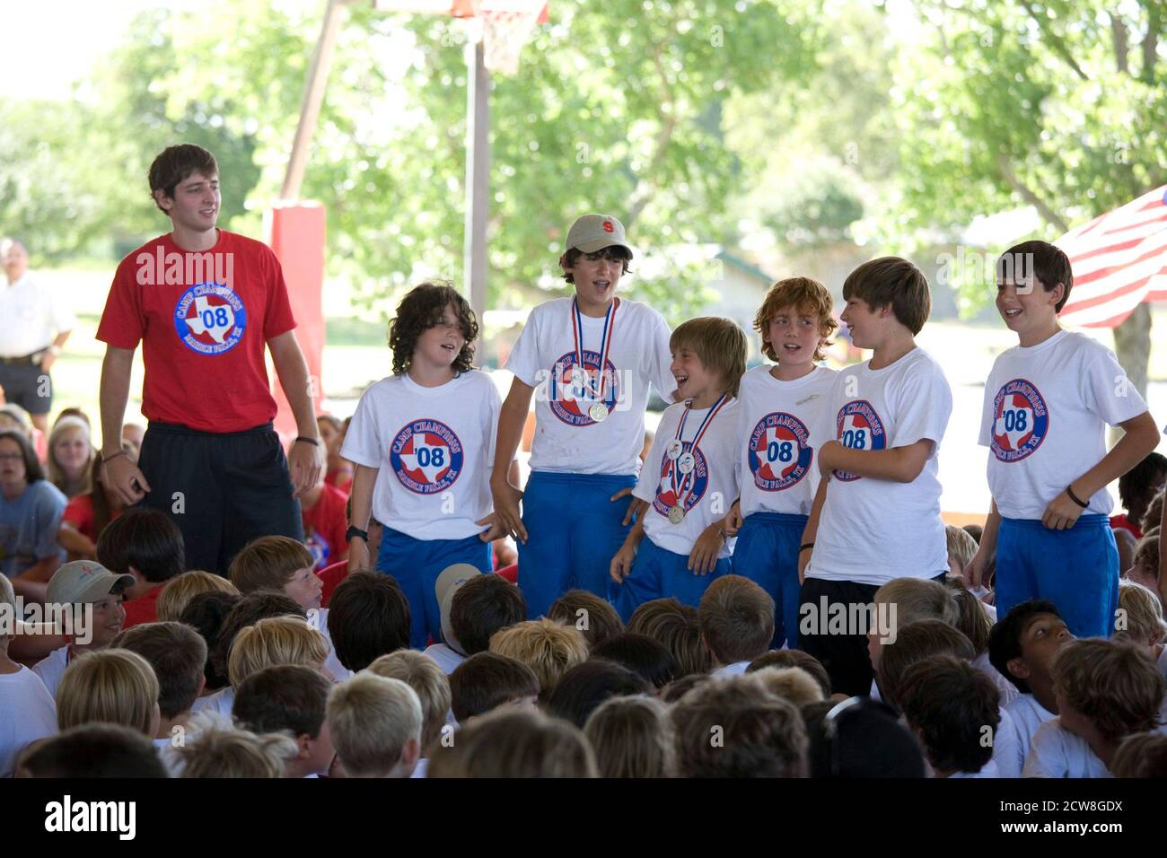 Granite Shoals, Texas: July 20, 2008: Final day of a three-week summer camp for 8-14-year-olds at Camp Champions on the shores of Lake LBJ.  A counselor (l) leads his 14-year old campers in a song on the final day.  ©Bob Daemmrich Stock Photo
