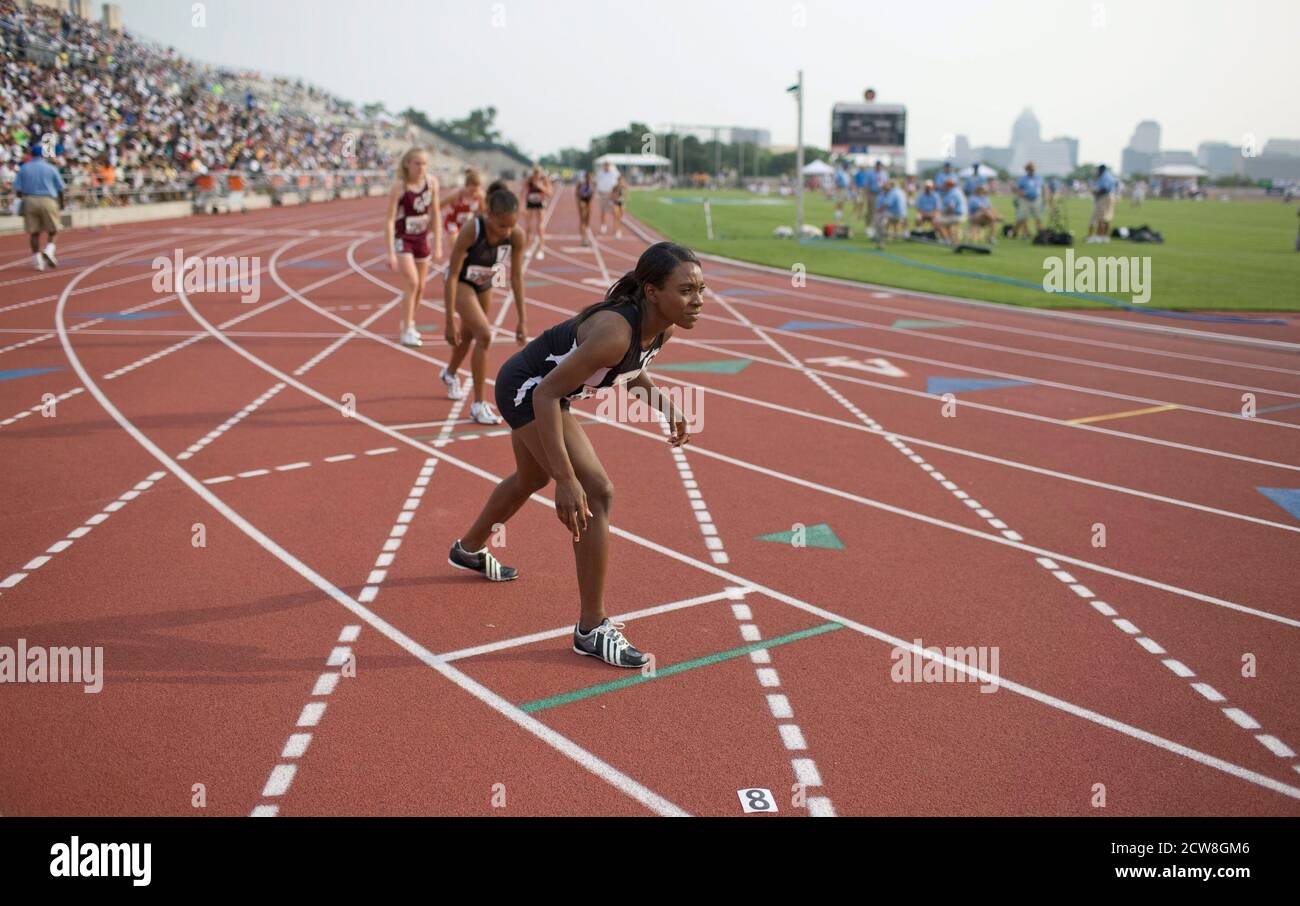 Austin, TX May 10, 2008: African-American girl gets set for the start of her distance race at the Texas high school state championship track meet at the University of Texas at Austin. ©Bob Daemmrich Stock Photo