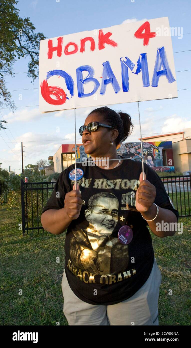 Austin, Texas November 4, 2008: Election day on the predominately African-American near east side of downtown Austin showing Barack Obama supporter Kay Wolfe Turner outside a polling place. ©Bob Daemmrich Stock Photo