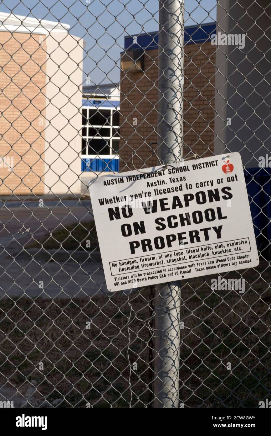 Austin, TX May 8, 2007: Signs prohibiting weapons outside the Ann Richards School for Young Women Leaders in Austin. The all-girls public school opened its doors in August, 2007 and was named after the former popular Texas governor. The school earned success in its first year by posting some of Austin's highest passing rates on standardized tests.        ©Bob Daemmrich/ Stock Photo