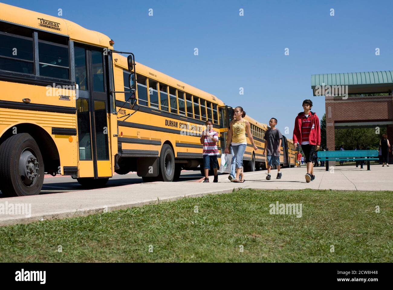 Pflugerville, TX  June 2, 2008: Middle school students leaving on buses at Park Crest Middle School in an Austin suburb. ©Bob Daemmrich Stock Photo