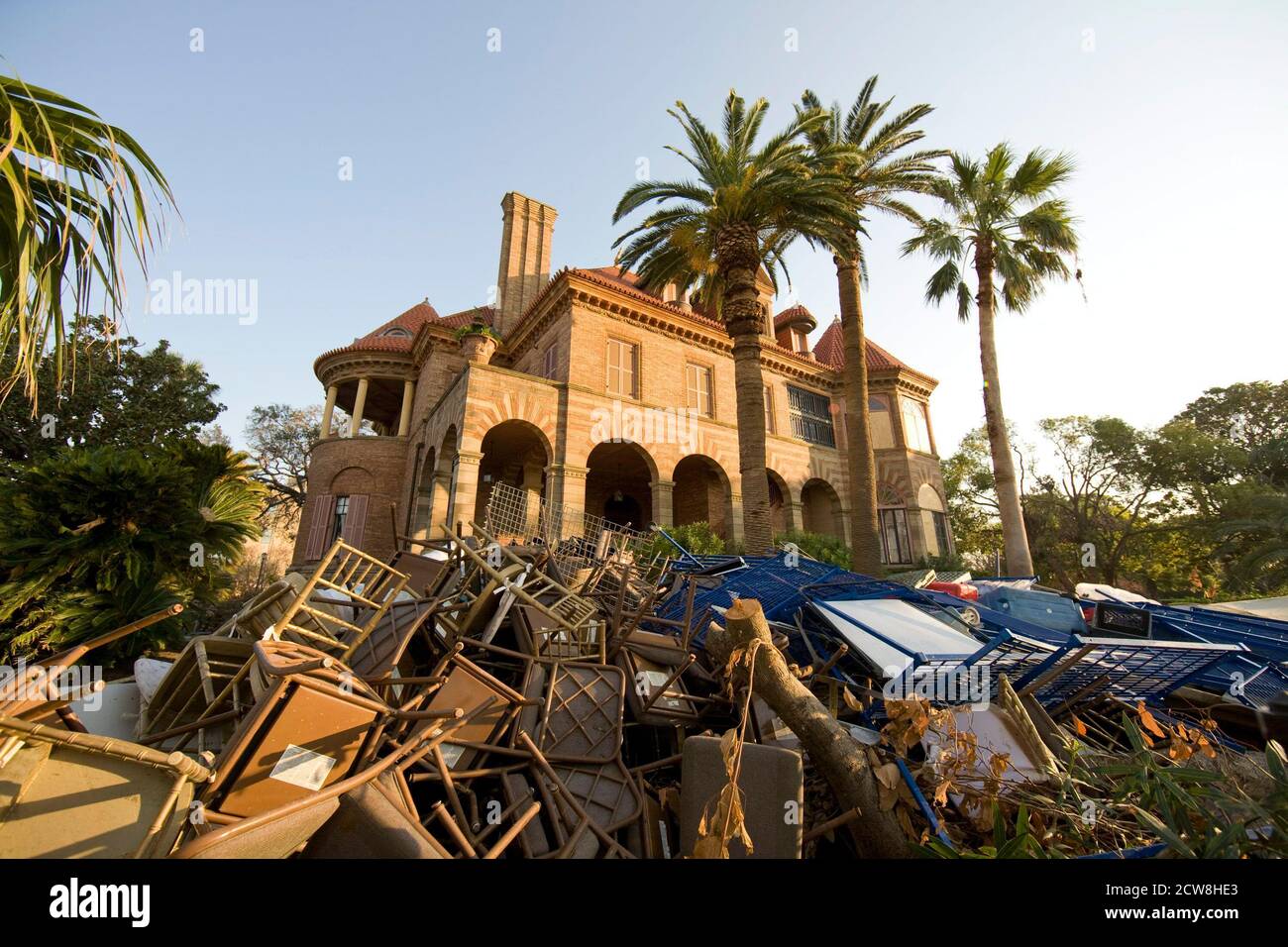 Galveston, Texas September 27, 2008:  A trash heap covers the grounds outside the historic Sealy Mansion in historic Galveston as residents struggle to clean up the mess more than two weeks after Hurricane Ike ravaged the Texas Coast. ©Bob Daemmrich Stock Photo