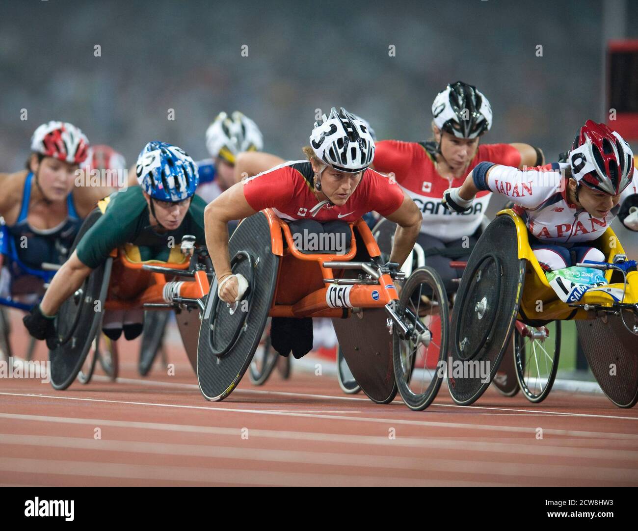 Beijing, China  September 8, 2008: Second day of athletics at the Bird's Nest during the Paralympics. Canada's Diane Roy (1251) leads the pack before winning the women's 5000-meters T54 class in a crash-marred race that saw six competitors not finish.  ©Bob Daemmrich Stock Photo
