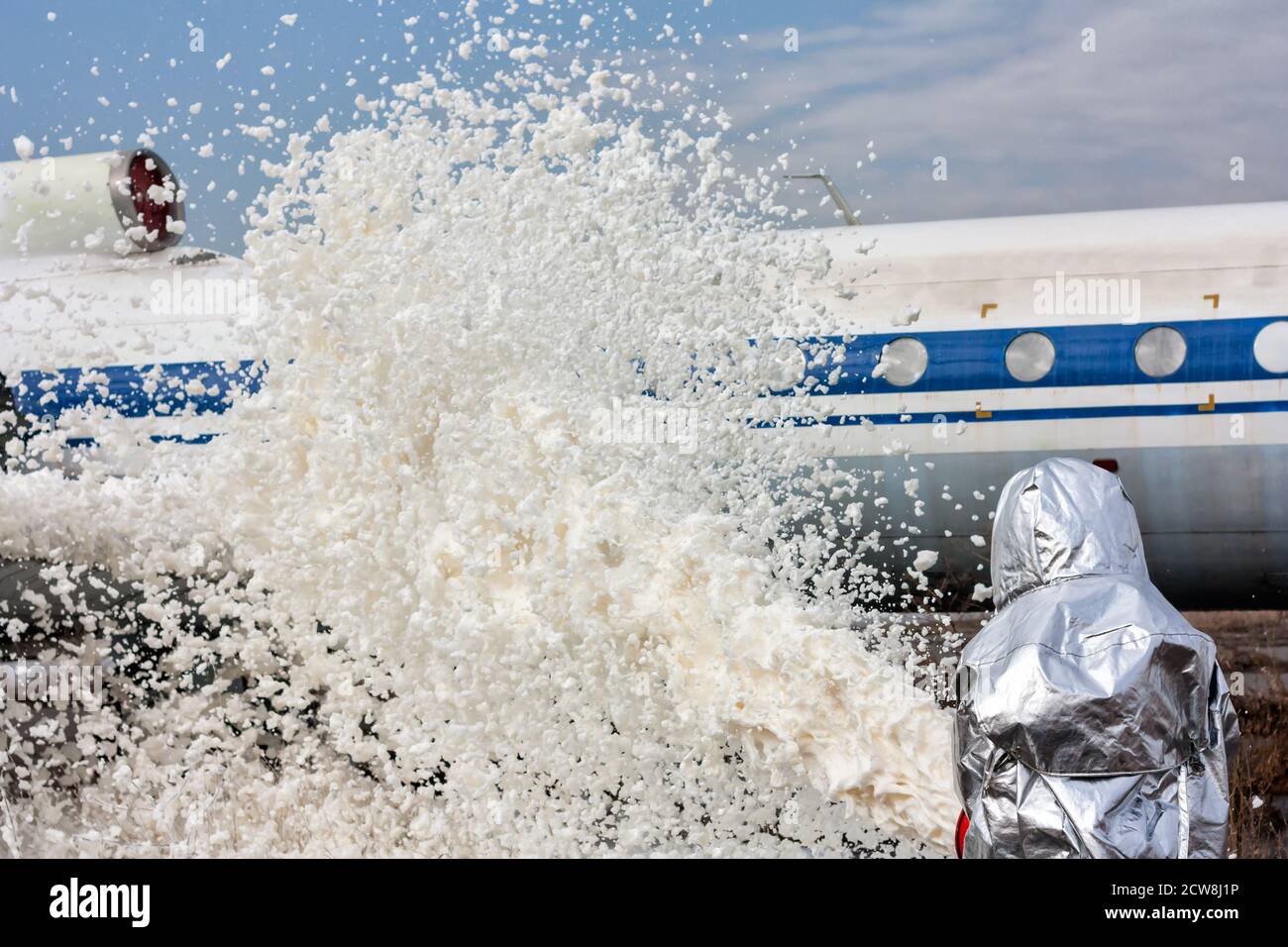 Fill the plane with firefighting foam after emergency landing Stock