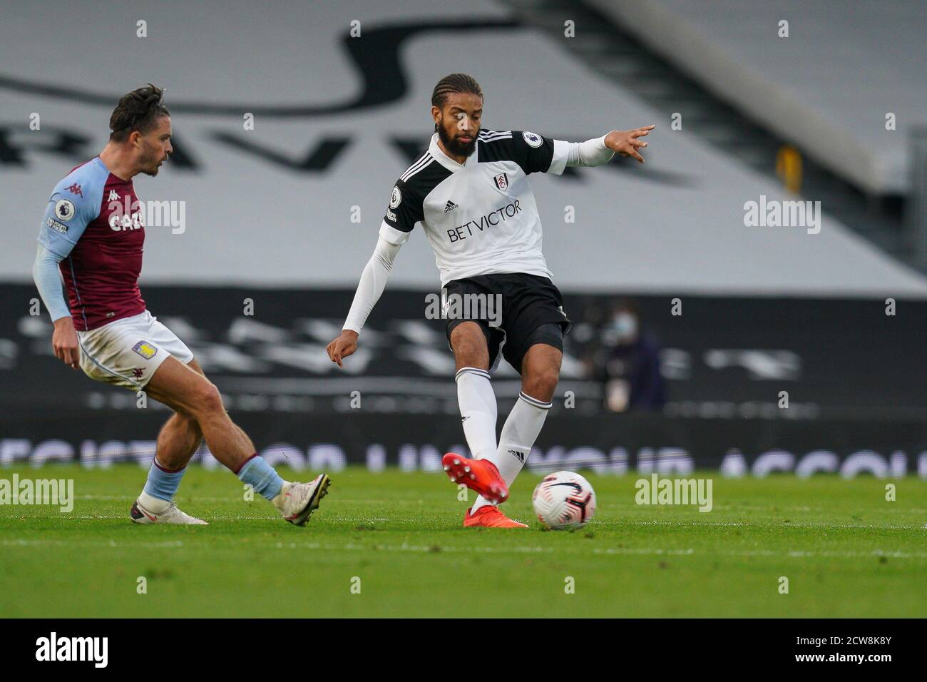 London Uk 28th Sep Andre Frank Zambo Anguissa Of Fulham Right Under Pressure From Jack Grealish Of Aston Villa Left During The Premier League Match Between Fulham And Aston Villa Played Behind