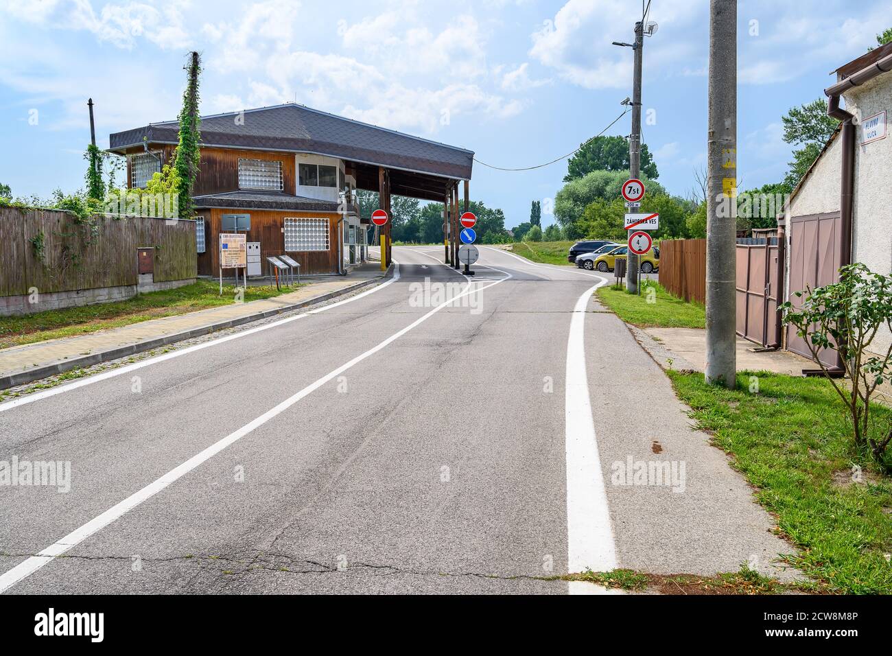 ZAHORSKA VES, SLOVAKIA – JULY 21 2020: End of village Zahorska Ves, building of former passport control of border crossing from Slovakia to Austria (S Stock Photo