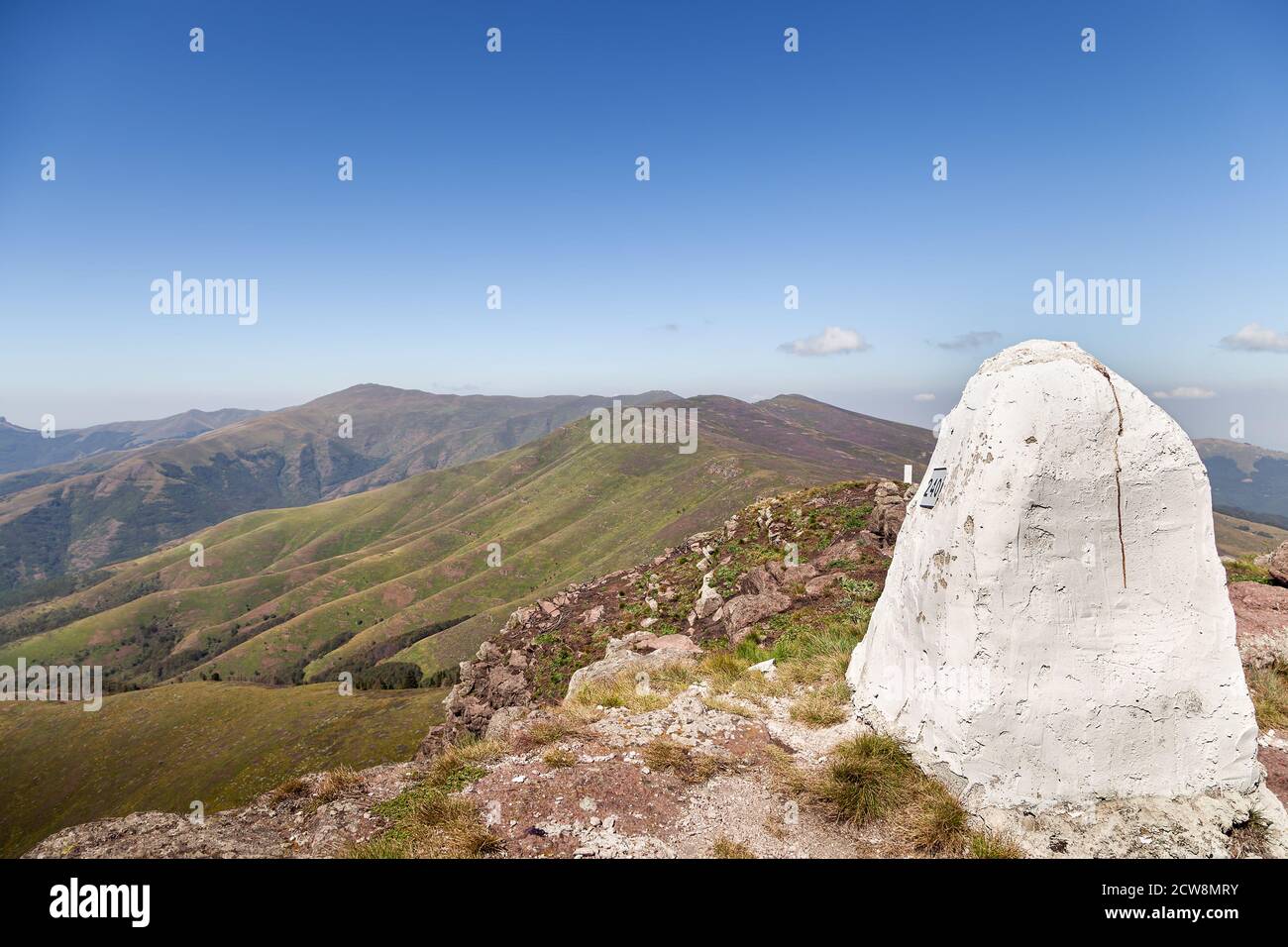 Epic view from Devil's head (Vrazja glava) peak on Balkan mountains (Stara planina) in Serbia of a rolling hills and distant Midzor summit Stock Photo