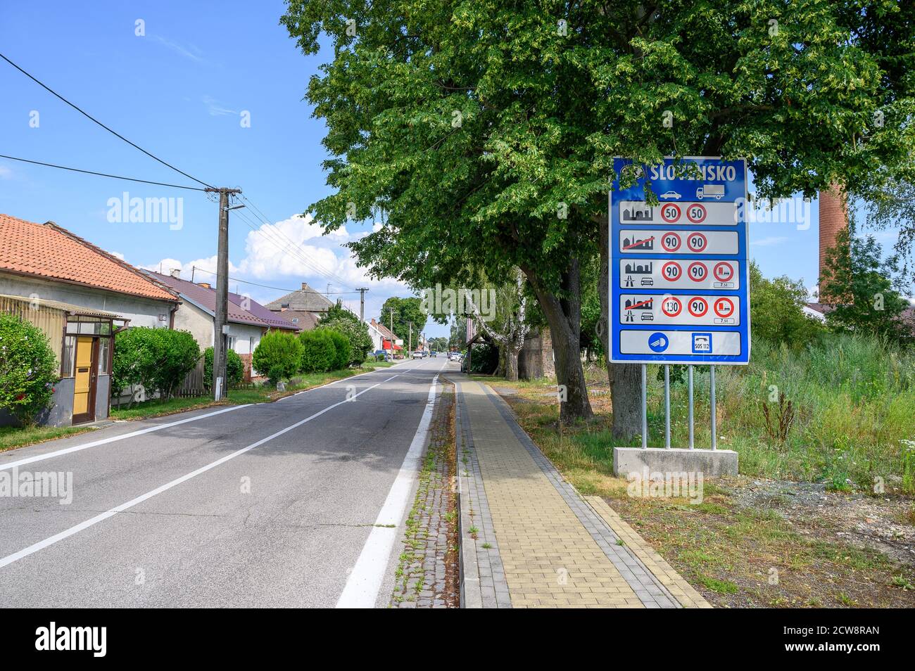 Big blue board with speed limits in Slovakia on entrance road to village Zahorska Ves (SLOVAKIA) Stock Photo
