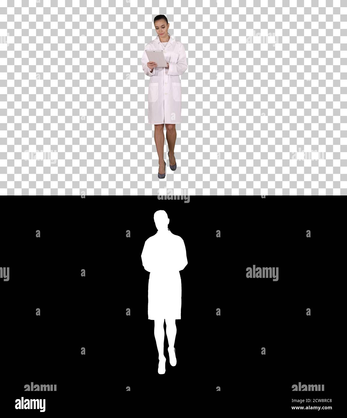 Doctor using tablet while walking, Alpha Channel Stock Photo