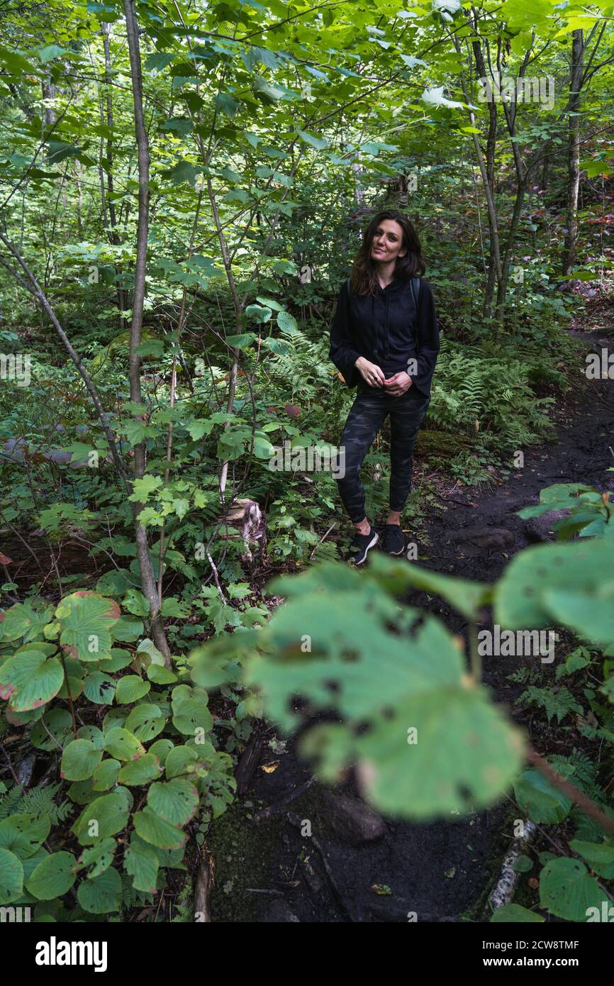 A young woman hiking on a trail in the Adirondacks Stock Photo - Alamy