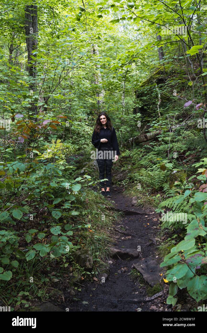 A young woman hiking on a trail in the Adirondacks Stock Photo - Alamy